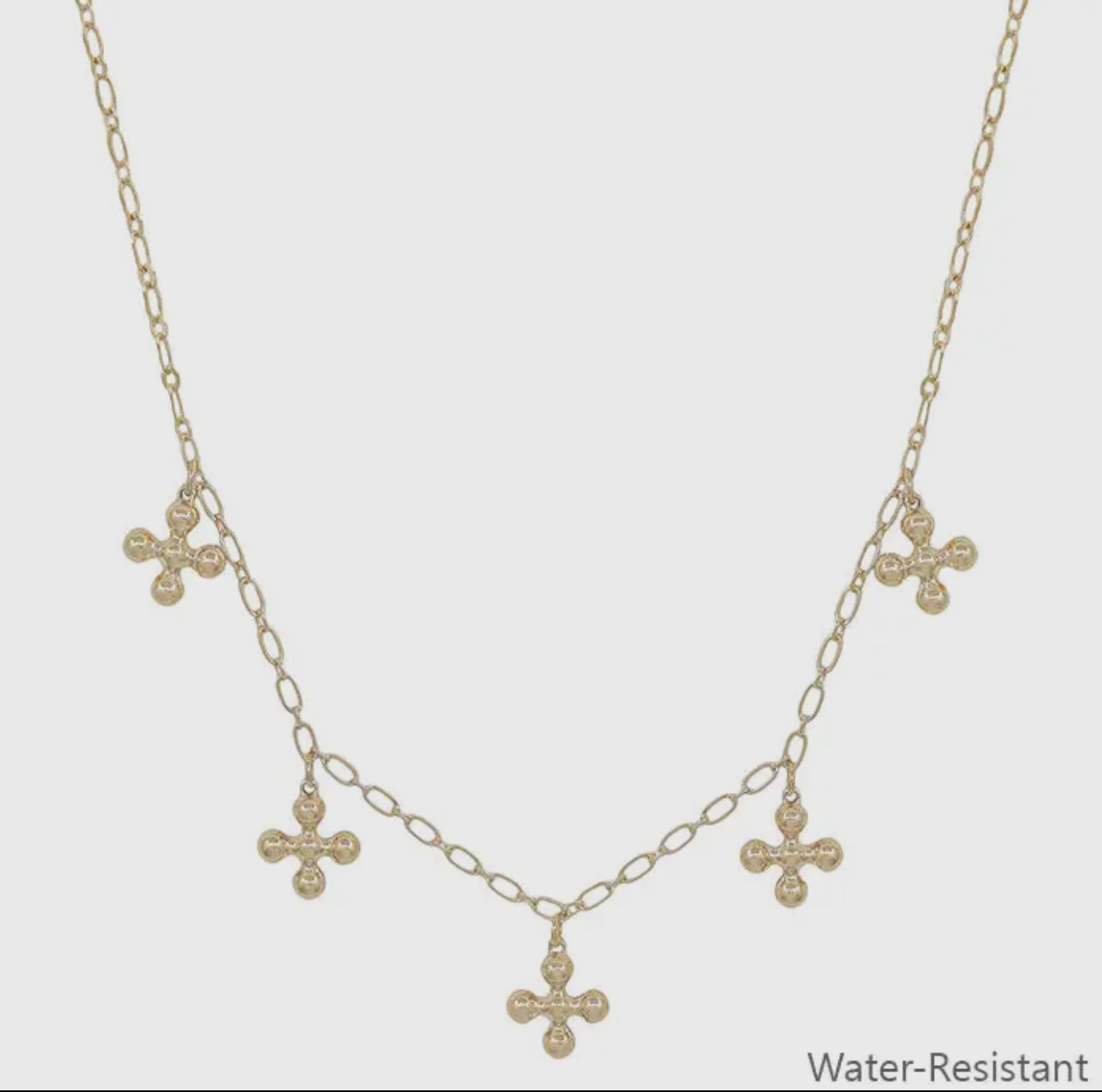 Gold beaded cross charm necklace