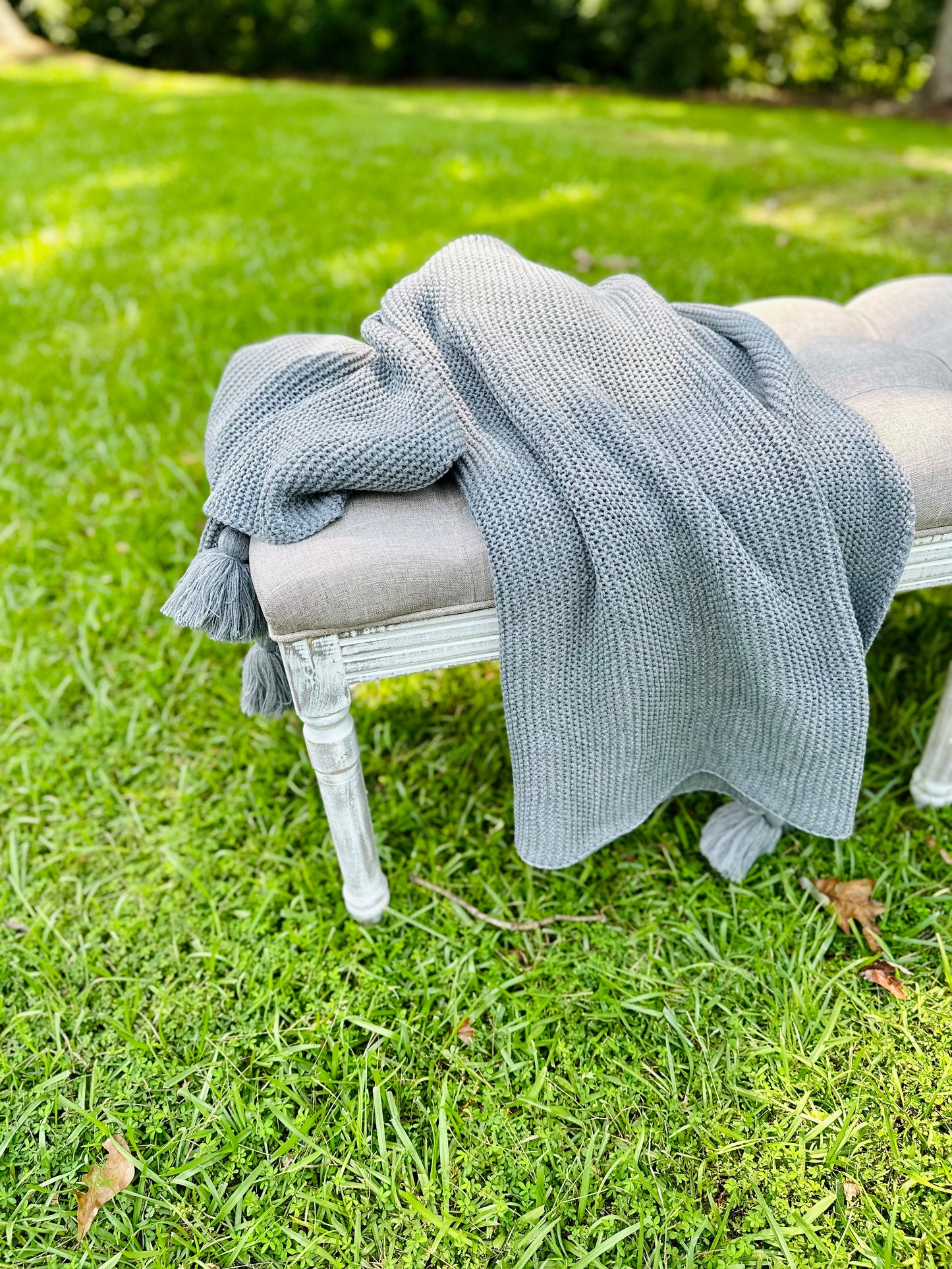 Knit throw blanket with tassels