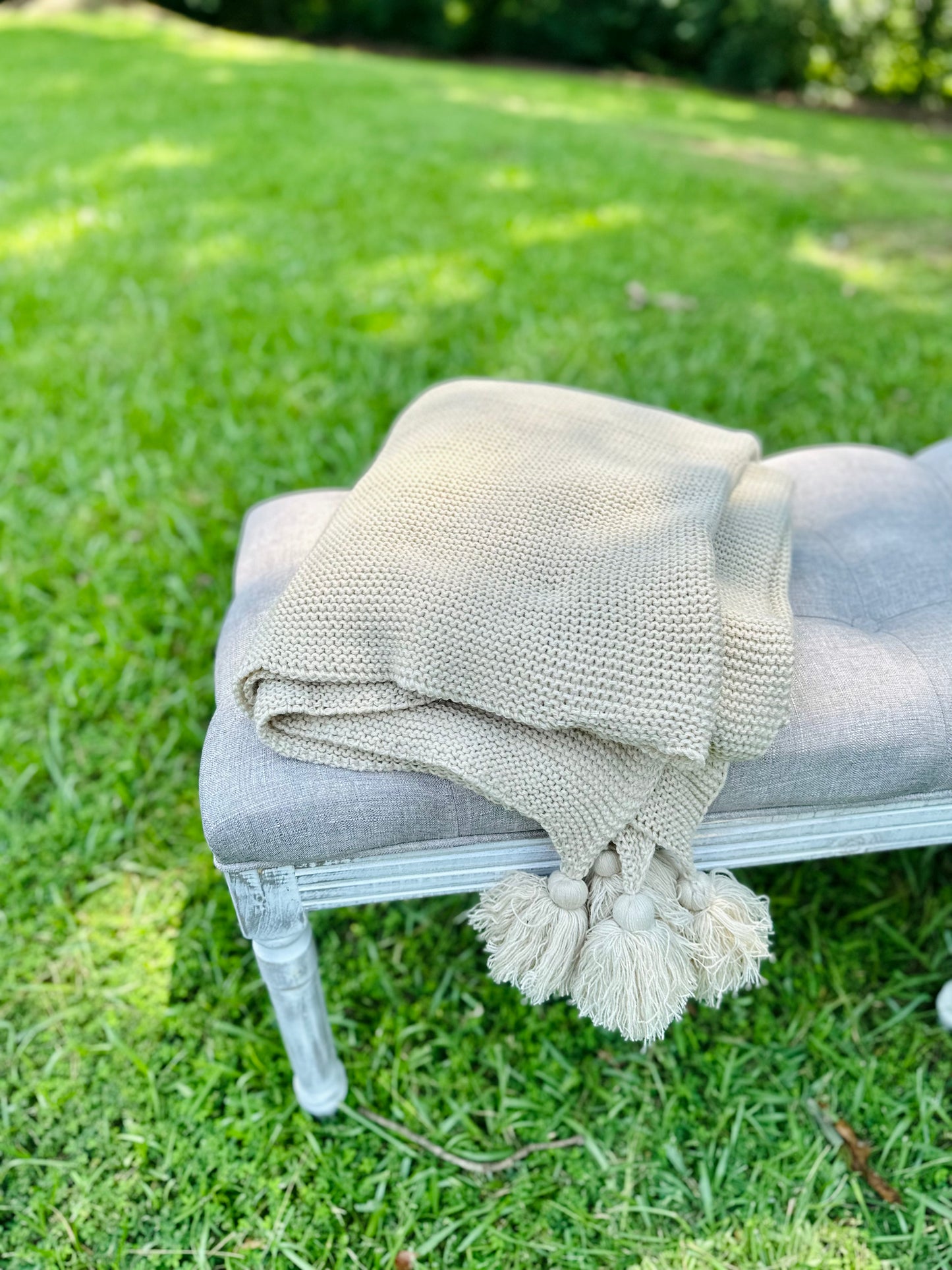 Knit throw blanket with tassels