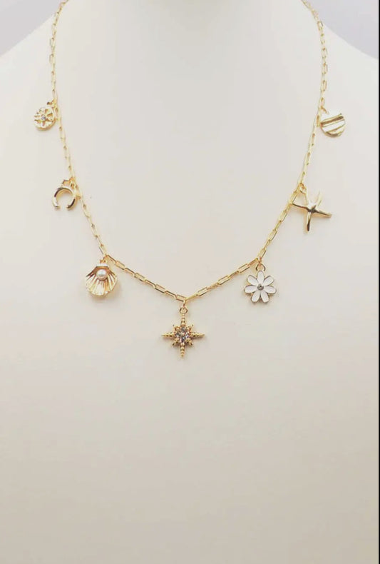 Gold starburst charm necklace