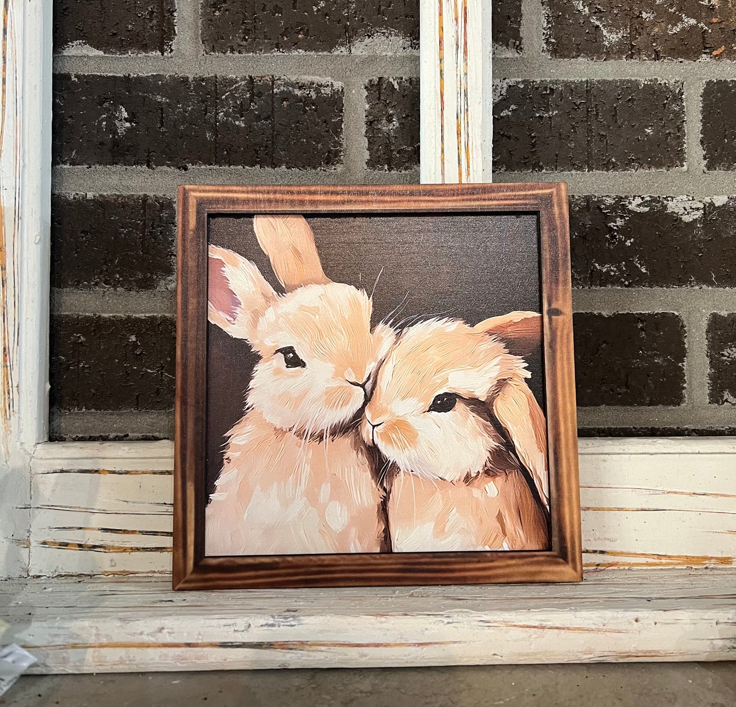 Two bunnies sign