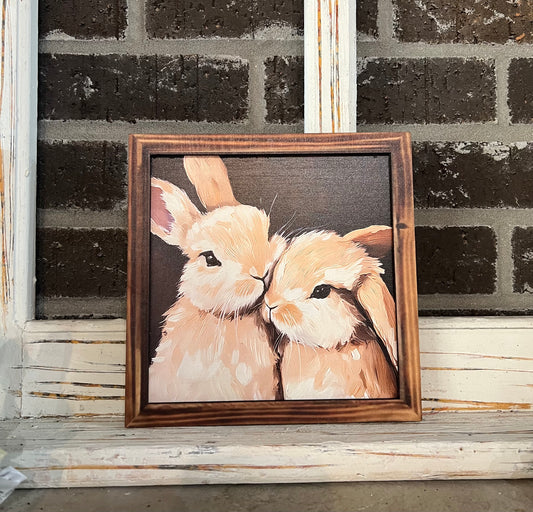 Two bunnies sign