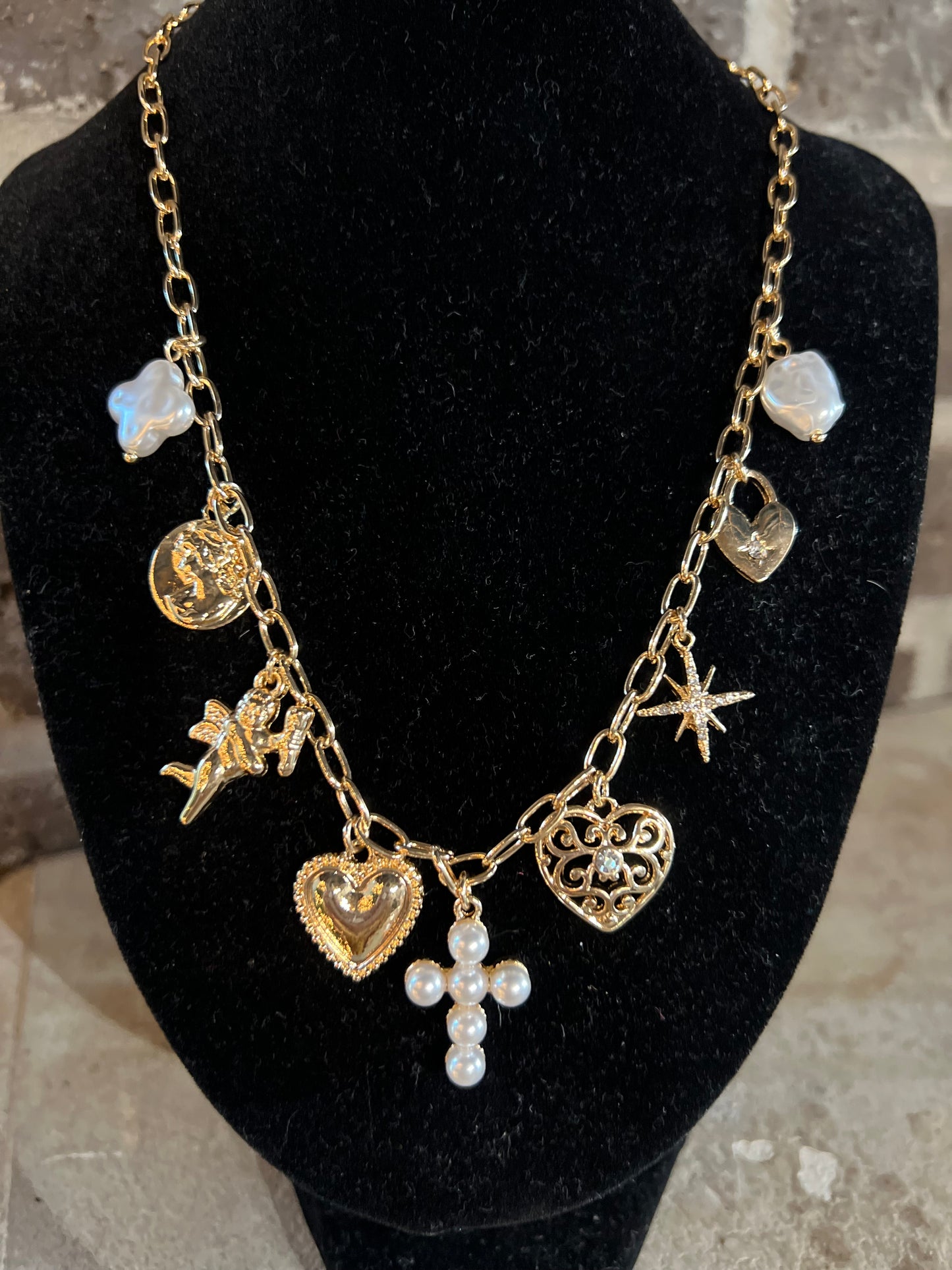 Gold chain with pearl cross